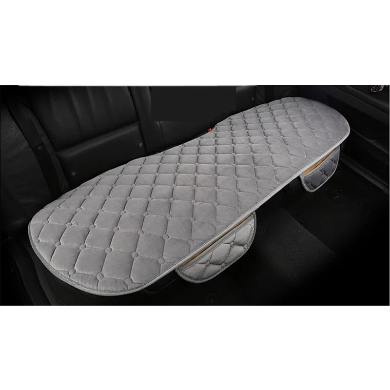 Gray car seat cover on a black car interior