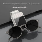 Sunglasses with a car mount on a reflective surface, featuring text about product features.