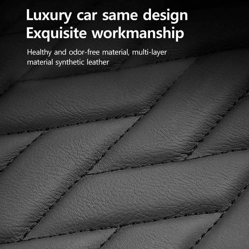 Close-up of quilted black leather material with text on a black background