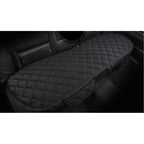 Black quilted car seat cover on a vehicle seat