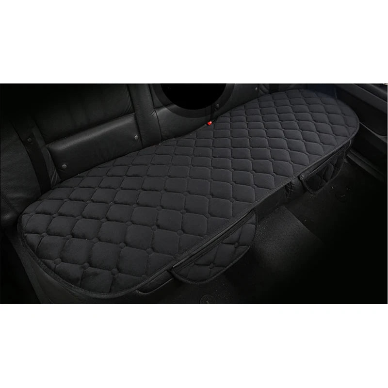 Black quilted car seat cover on a vehicle seat