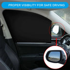 Car interior with a sunshade over the windshield and a side mirror showing reduced visibility.